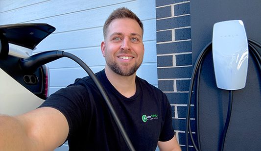 Rick from Easy Switch Electrical installing an EV charger