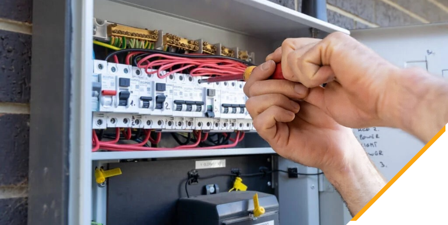 An electrician upgrading a faulty metre box