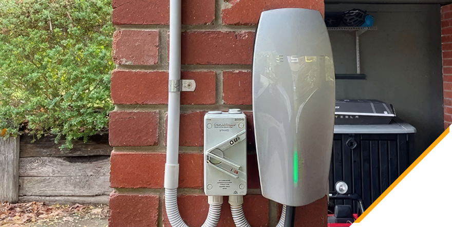 A newly installed Tesla residential EV charging station