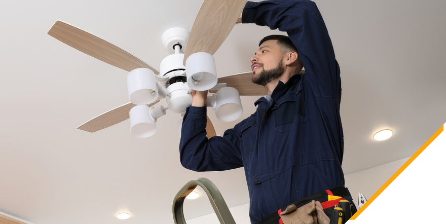 An Easy Switch Electrical electrician installing a ceiling fan